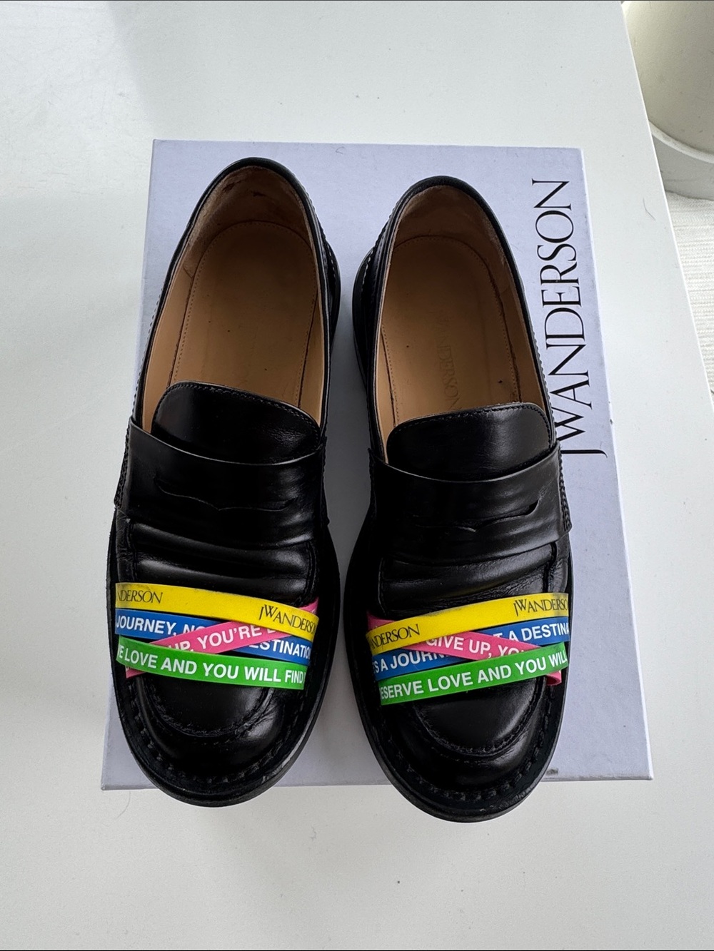 JW ANDERSON Black Leather Penny Loafers with Rainbow Band Accents, size 7